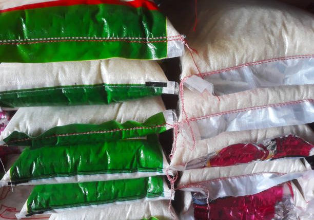 pile of sacks of rice in the retail market groceries shop