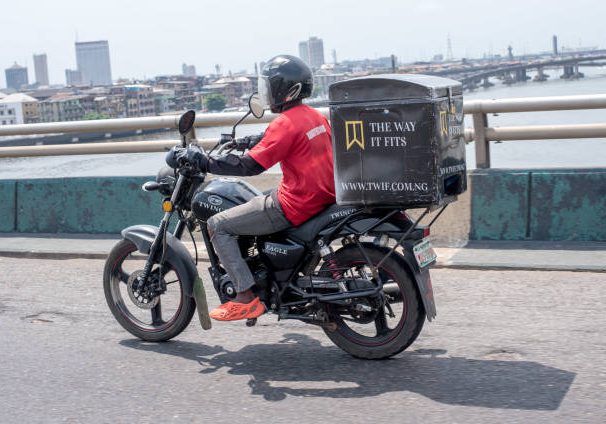 Everyday life in Lagos as a logistics delivery bike rides along a road on Third Mainland Bridge, Lagos, Nigeria on November 18, 2022.