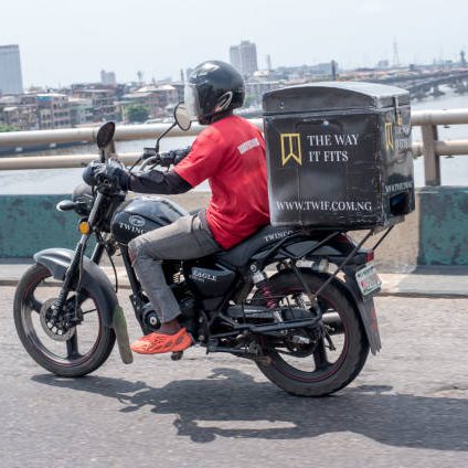 Everyday life in Lagos as a logistics delivery bike rides along a road on Third Mainland Bridge, Lagos, Nigeria on November 18, 2022.